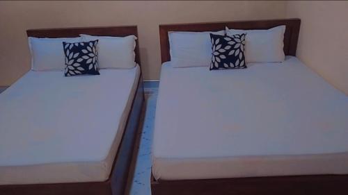 سرير أو أسرّة في غرفة في Arana Holiday Resort