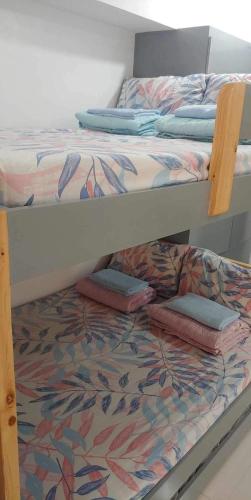 a couple of bunk beds with pillows on them at SUNTRUST 88 GIBRALTAR - BAGUIO in Baguio