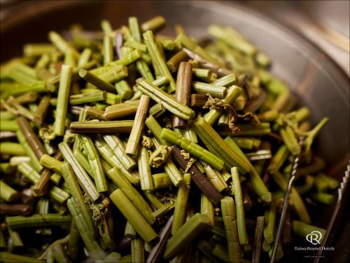 a bowl full of green beans and chop sticks at Daiwa Roynet Hotel Sendai in Sendai