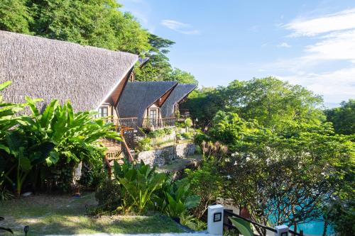 an aerial view of a house with trees at Nawa Wellness in Calatagan