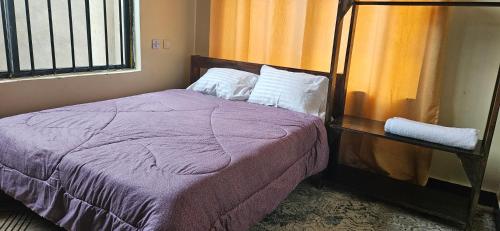 Cama o camas de una habitación en Kamili Homes - Apt 2, Morogoro