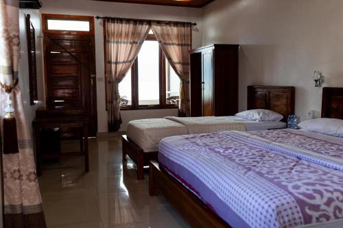 Ліжко або ліжка в номері Gokhon Guest House