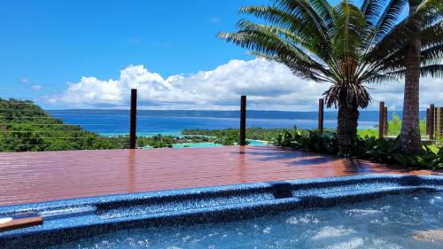 a swimming pool with a view of the ocean at Longview - stunning views, sleeps 8 in Port Vila
