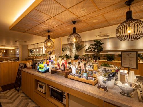 a store with a counter in a store with a counter sidx sidx at Super Hotel Yamaguchi Yuda Onsen in Yamaguchi