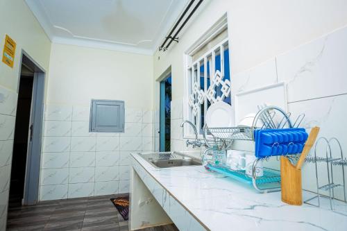 a kitchen with a sink and a counter top at MUTIMA VILLA in Jinja