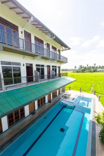 an aerial view of a house with a swimming pool at Serene Park Hotel By Ark in Tissamaharama