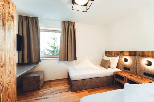 Säng eller sängar i ett rum på Burgstadl Aparthotel & Restaurant