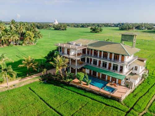 an aerial view of a house with a swimming pool at Serene Park Hotel By Ark in Tissamaharama