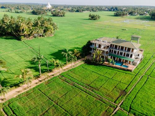 an aerial view of a house in a field at Serene Park Hotel By Ark in Tissamaharama