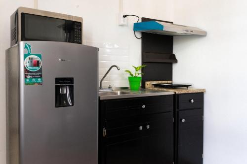 Una cocina o cocineta en Suites Apodaca