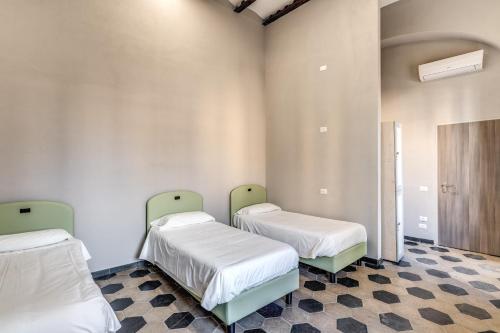 Ένα ή περισσότερα κρεβάτια σε δωμάτιο στο Borgo Ripa Urban Travel