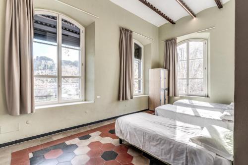 Кровать или кровати в номере Borgo Ripa by Hostel Trastevere