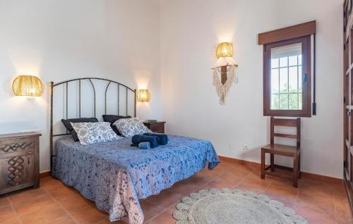 a bedroom with a bed with a blue teddy bear on it at Amazing Home In Algarrobo With Wifi in Algarrobo