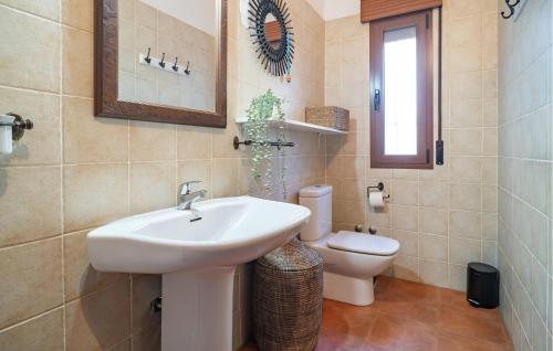 a bathroom with a sink and a toilet at Amazing Home In Algarrobo With Wifi in Algarrobo