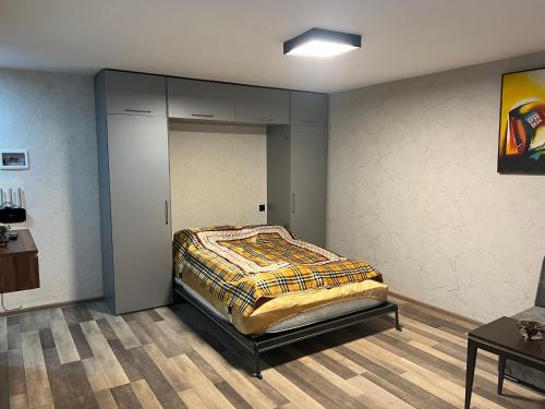 a bedroom with a bed in a room at Cozy nest in Baku