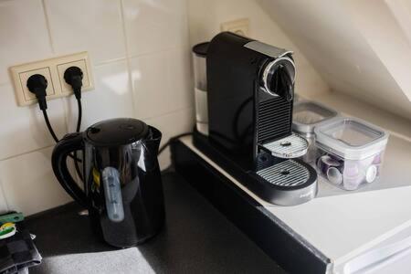 a microwave sitting on a counter in a kitchen at Peaceful 2 Bedroom Apartment - TS307B in Eindhoven