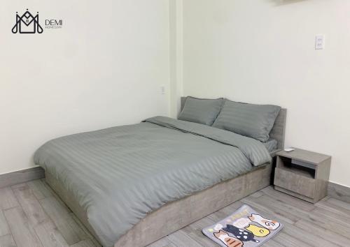 Una cama o camas en una habitación de DeMi Homestay 2 - Châu Đốc