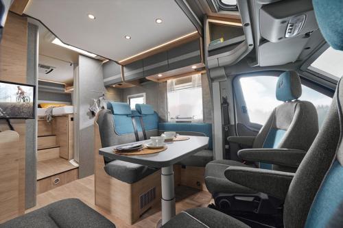 an interior of an rv with a table and chairs at B-Happy - Deine Wohnmobilvermietung in Parey