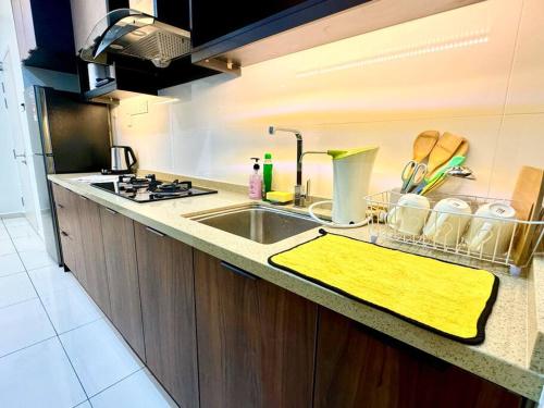 a kitchen counter top with a sink and a sink at Decozy7.0 Ipoh Town Condo(12pax) in Ipoh