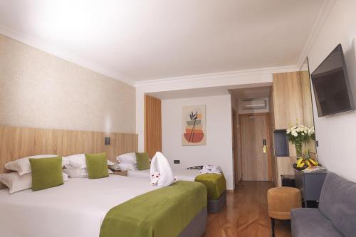 Cama o camas de una habitación en Hotel Argana Agadir