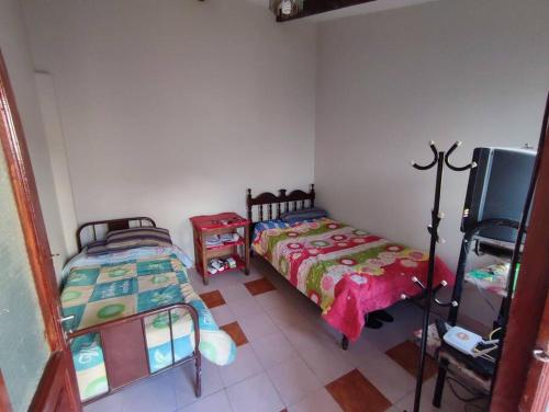 Postel nebo postele na pokoji v ubytování Acogedora, independiente y tradicional Casa - Karapanza