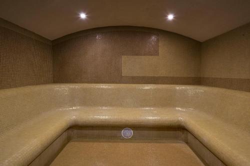 a large bath tub in a bathroom with at Radisson Hotel Plovdiv in Plovdiv