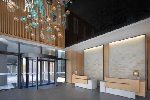 a lobby of a building with a chandelier at Fairfield by Marriott Shanghai Lingang Special Area in Shanghai