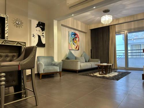 a living room with a couch and a fireplace at Modern apartment in Cairo