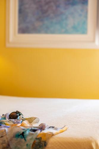 Ένα ή περισσότερα κρεβάτια σε δωμάτιο στο Marulivo Hotel