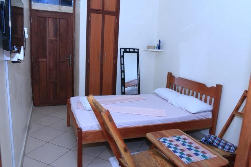 Ένα ή περισσότερα κρεβάτια σε δωμάτιο στο Fully furnished apartment in Nyali