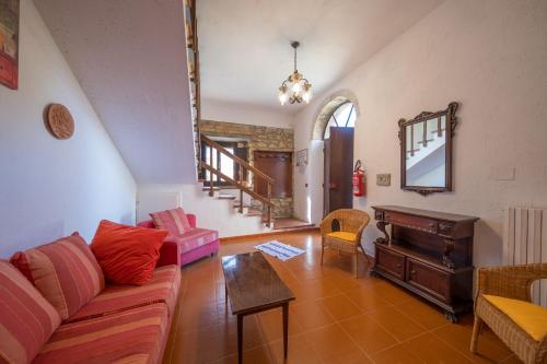 a living room with a couch and a piano at Agriturismo il Palagetto in Pomarance