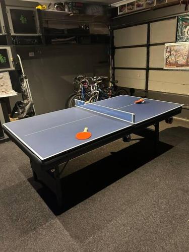 a ping pong table with two ping pong balls on it at Portarlington Family Fun House in Portarlington