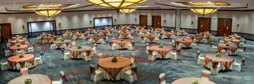 a large banquet hall with tables and chairs and chandeliers at Intercontinental Real Guatemala by IHG in Guatemala
