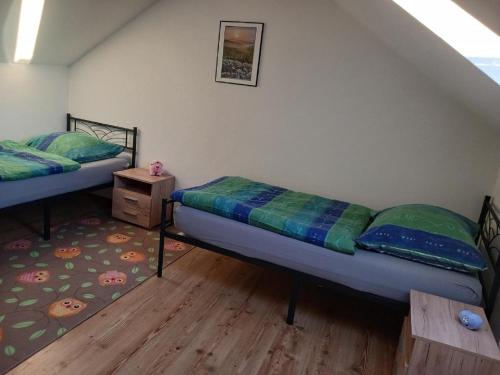 Posteľ alebo postele v izbe v ubytovaní Ferienhaus Barth mit Balkon