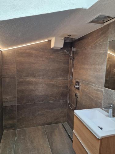 a bathroom with a shower and a sink at Haus Stegen in Maria Alm am Steinernen Meer