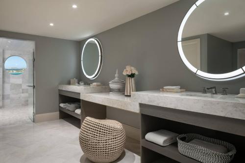 a bathroom with a sink and a mirror at The Ritz-Carlton St. Thomas in Benner
