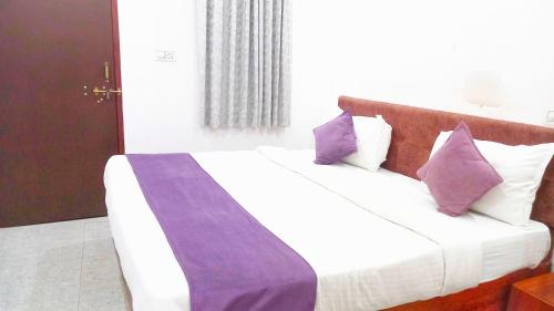 Krevet ili kreveti u jedinici u okviru objekta Hotel Mahima Palace