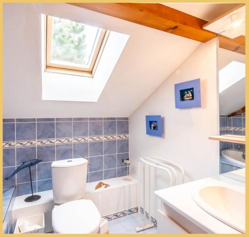 a bathroom with a toilet and a sink at Villa T5 Luxury Marcellaz in Marcellaz