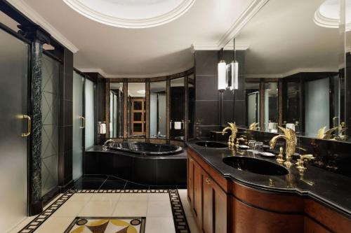 a bathroom with two sinks and two mirrors at The Westin Tokyo in Tokyo