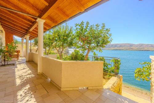 a house with a view of the water at Marva Cliff Apartments in Zubovići