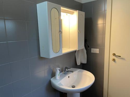 a bathroom with a sink and a medicine cabinet at LA QUERCIA Appartamenti in Ortona