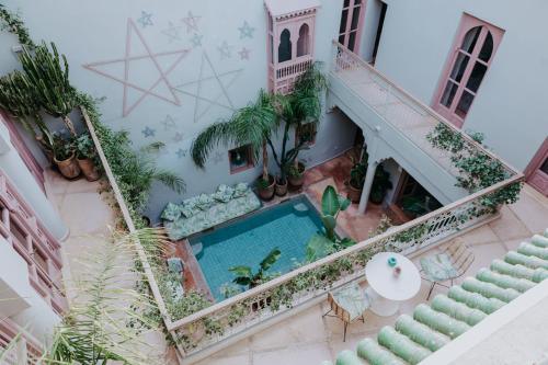 an aerial view of a house with a swimming pool at Riad 117 in Marrakech