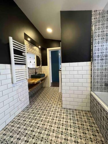a bathroom with a shower and a sink and a tub at Vento do Nordeste - Cottage with Jacuzzi in Nordeste
