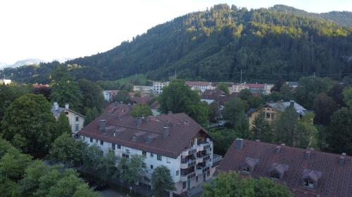 an aerial view of a town in front of a mountain at FeWo Immenstadt Apartment in Immenstadt im Allgäu