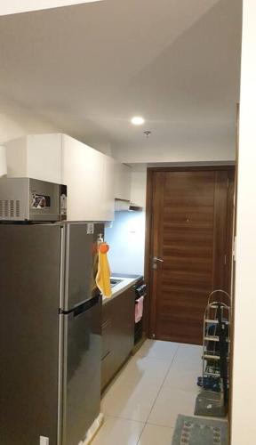 a kitchen with a stainless steel refrigerator at Horizon 101, Condo with a pool & view in Cebu City