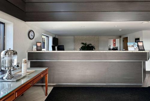 a barber shop with a counter in a room at Travelodge by Wyndham Welland in Welland