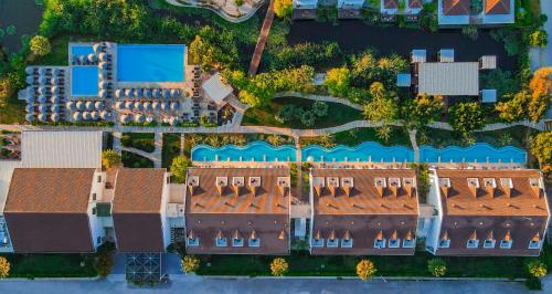 an overhead view of a group of buildings with roofs at Jiva Beach Resort - Ultra All Inclusive in Fethiye