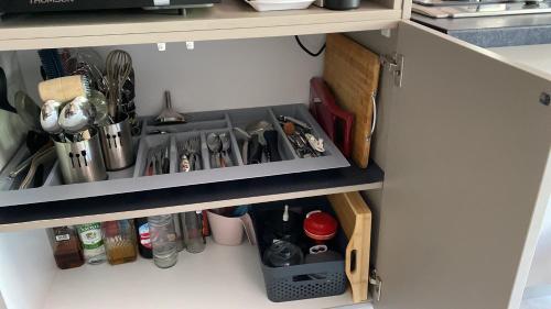 a kitchen drawer filled with lots of kitchen utensils at Villa des Grenadelles in Saint-Paul