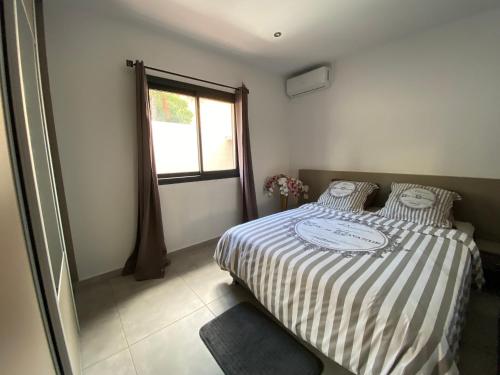 Postel nebo postele na pokoji v ubytování Villa des Grenadelles