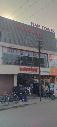 a store with bikes parked in front of a building at Vishram Inn in Alwar